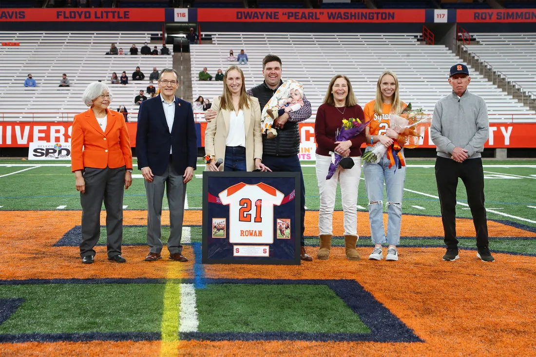 Athlete alumna being celebrated with her jersey.