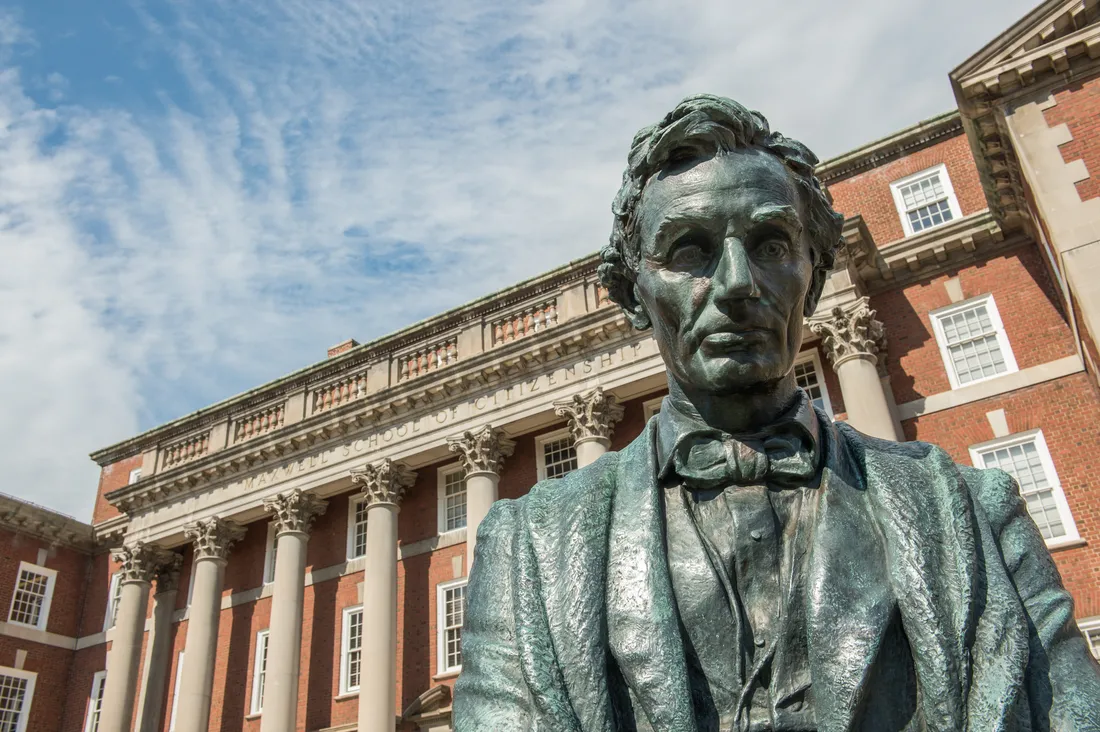 Statue of Abraham Lincoln in front of the Maxwell School of Public Affairs.