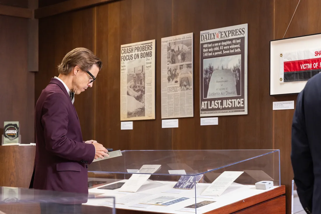 Person looking over archival museum materials.