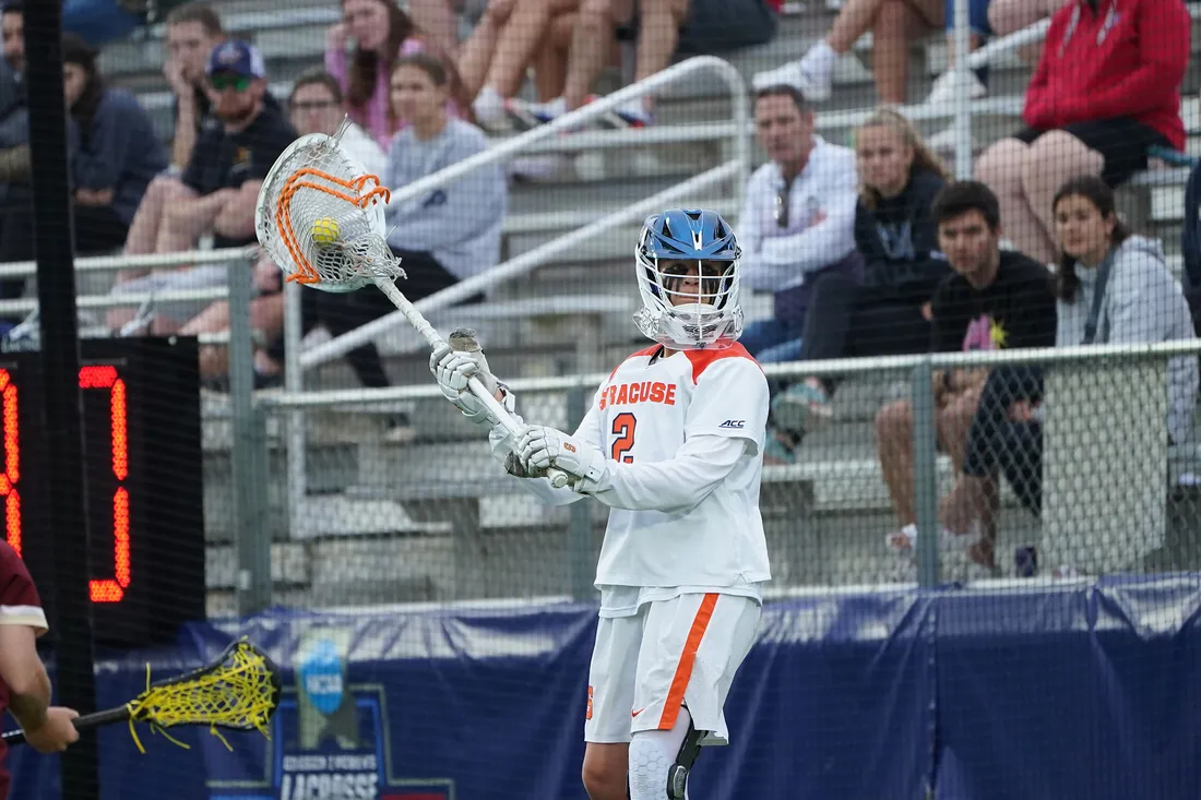 Player in lacrosse gear at championship game.