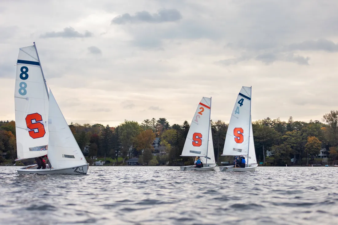 Syracuse Sailing Club boats on a body of water.