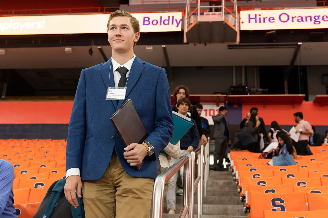 Will Mahaney in the dome wearing business casual entering the career fair.