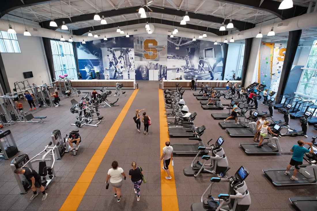 Students utilizing a fitness area within the Barnes Center.