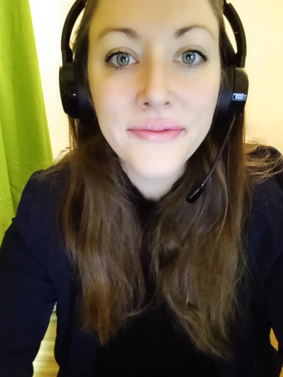 Headshot of Jen Proch wearing headphones.