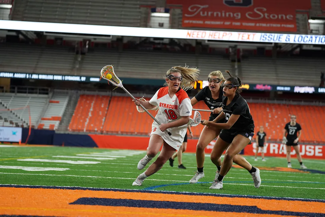Meaghan Tyrrell on the field competing in lacrosse.