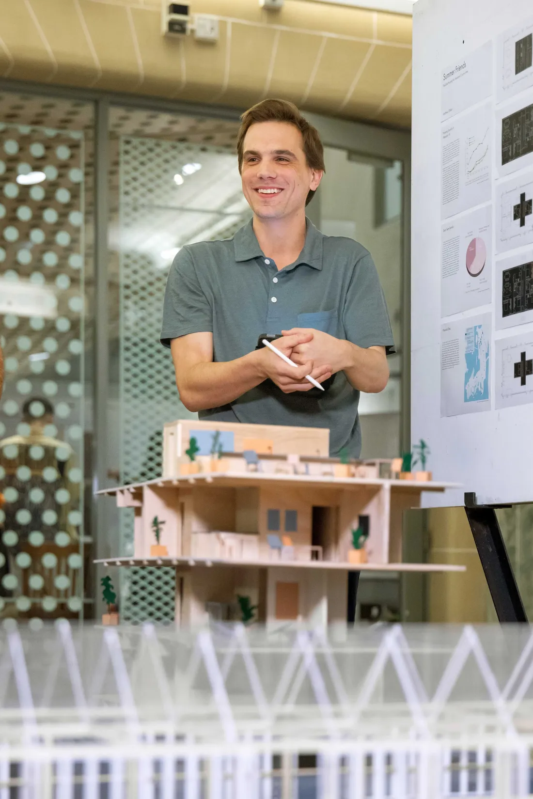An architecture student working on a final directed research review project.