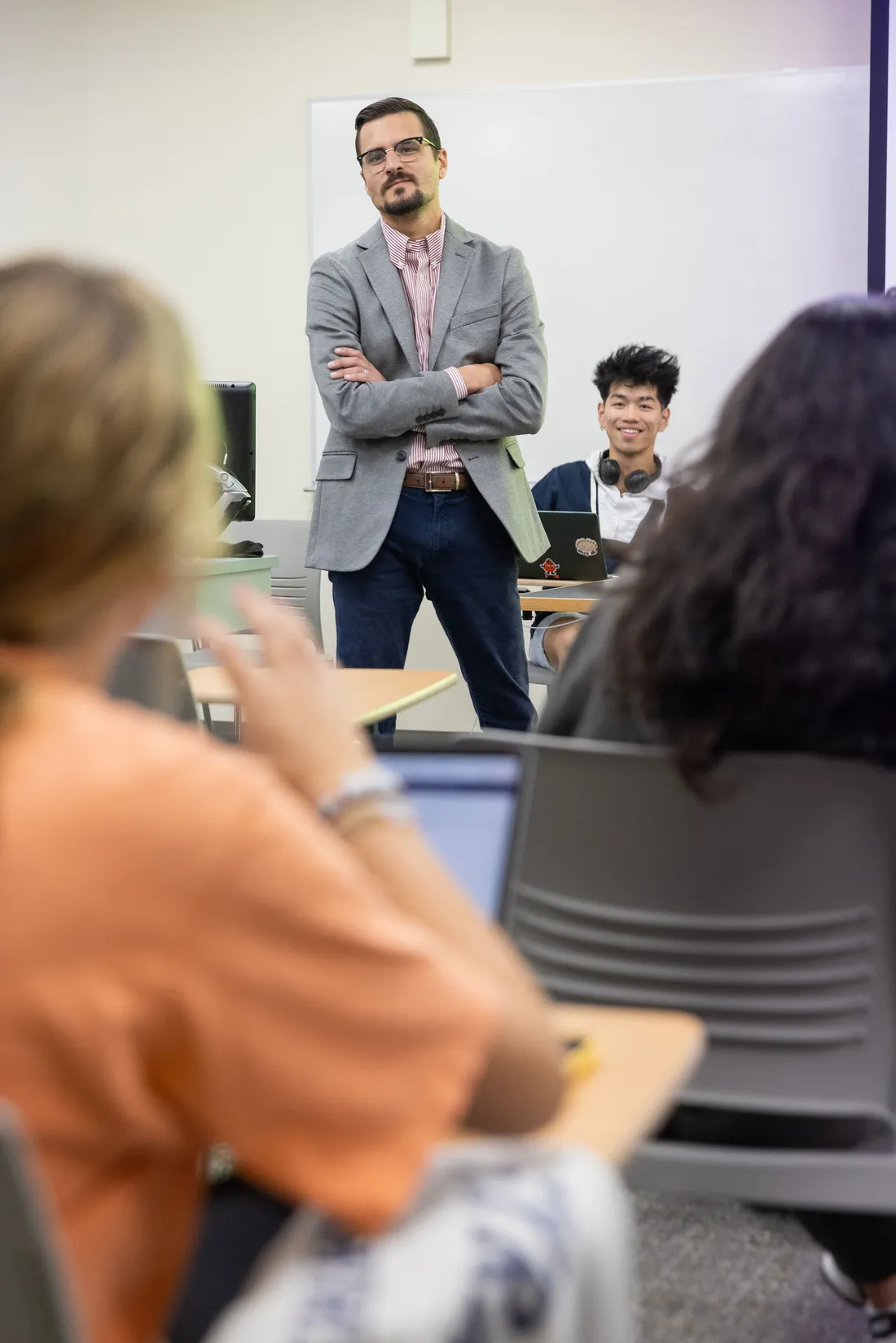 Person talking to a group of people.