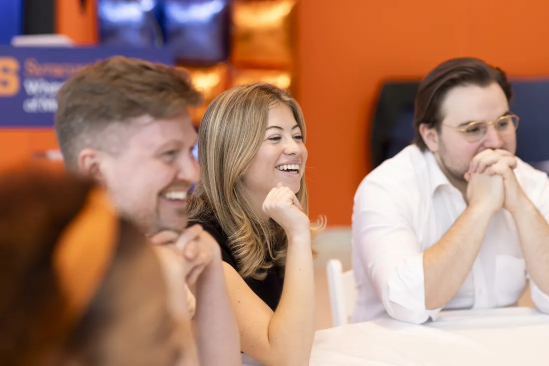 Haley Greene '26 and Blackstone Launchpad program manager Jonathan Wess sitting at a table attending the Cuse 50 Summit.