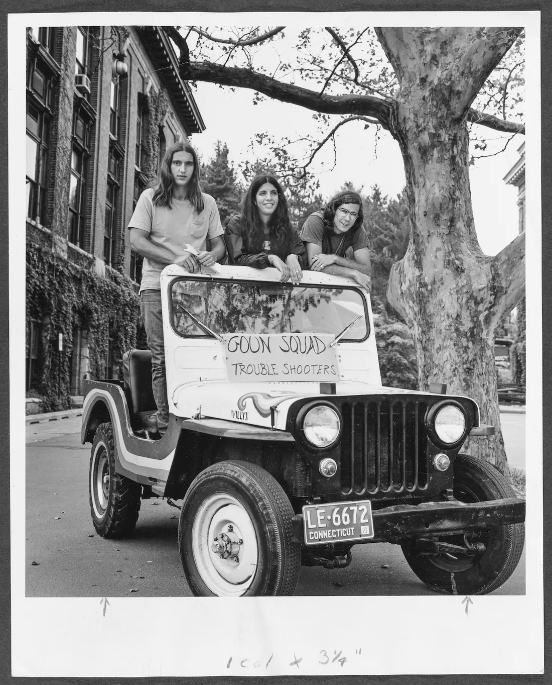 goon squad members pose in Jeep in photo from 1970s