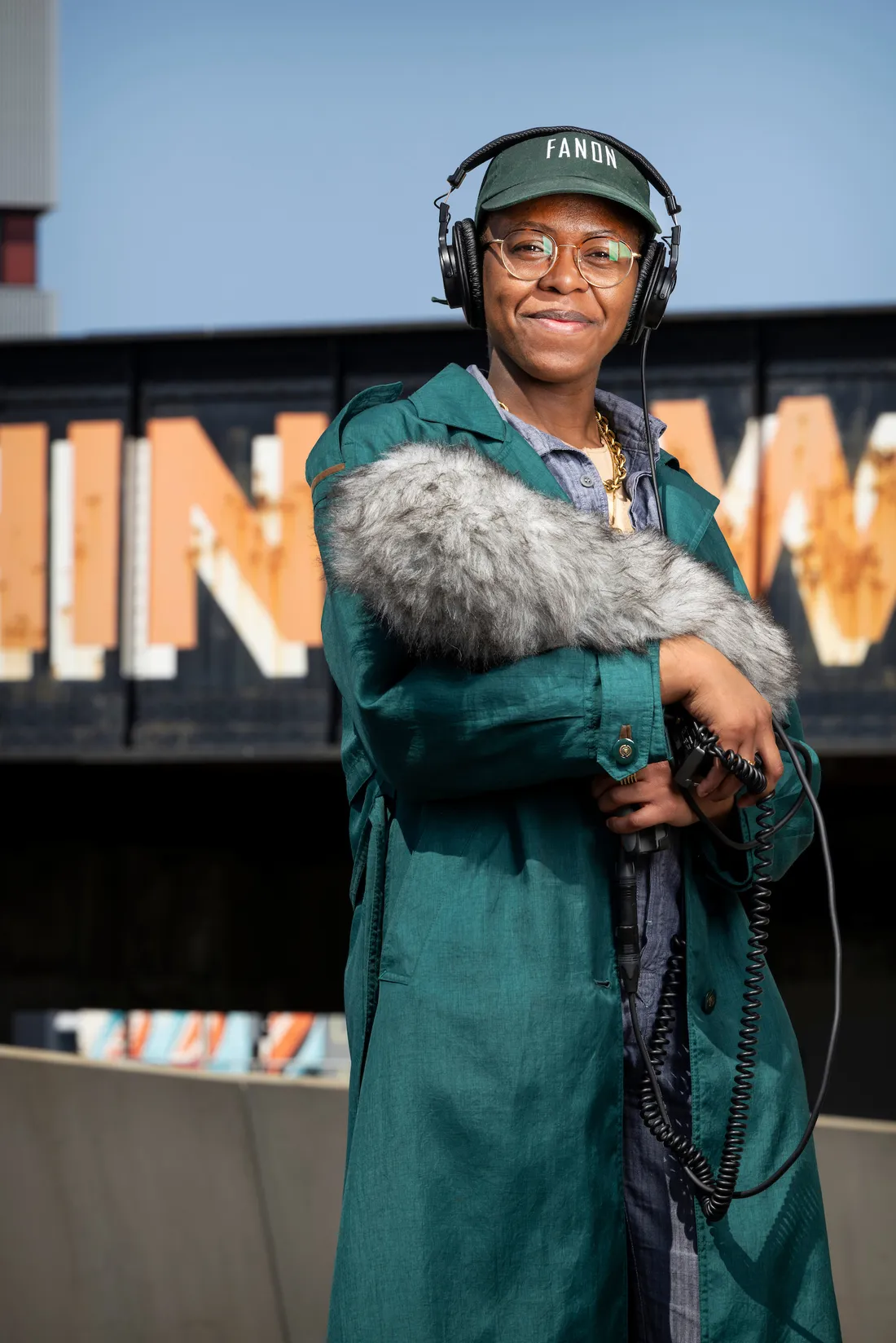 Jess Myers holding a boom microphone.