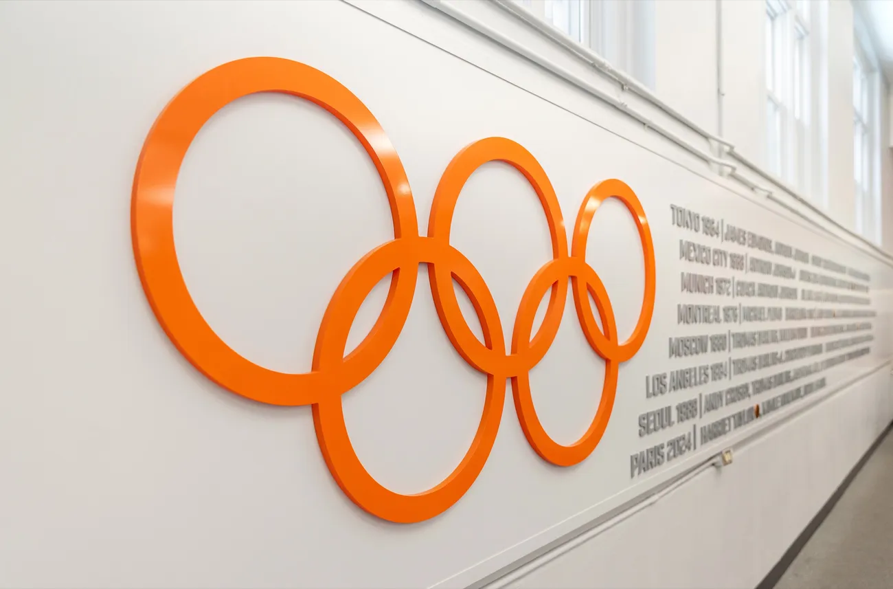 The six Olympic rings in the signature Syracuse orange color.