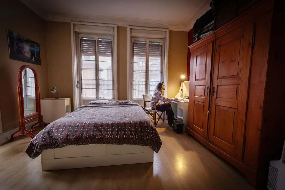 Student working at desk in bedroom