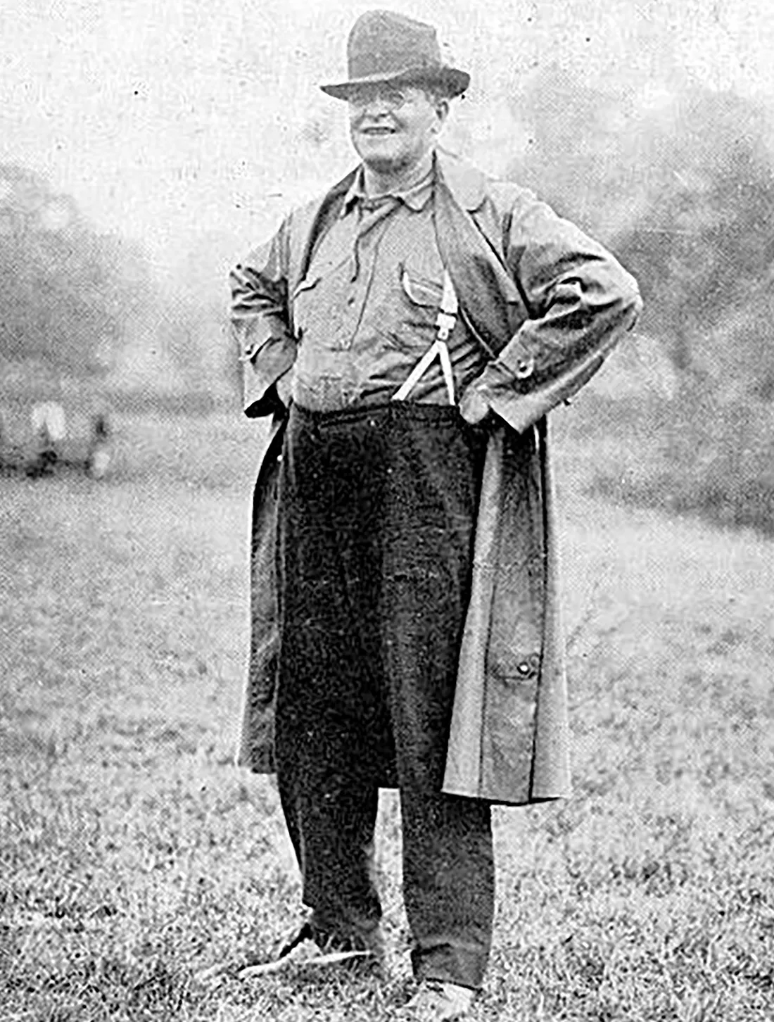 Glenn “Pop” Warner standing smiling.