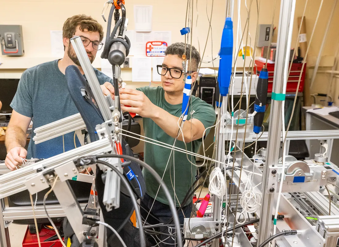 Two graduate students working together in laboratory.