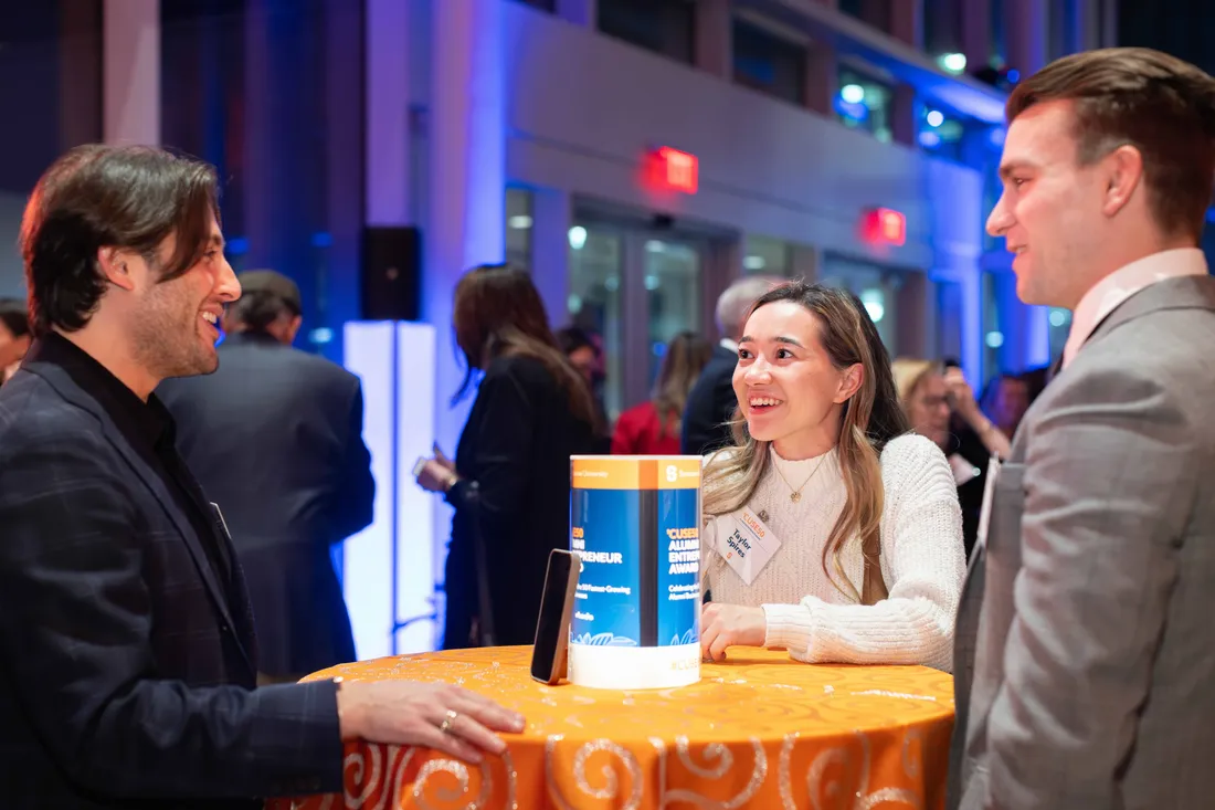 Students networking at an event on campus.