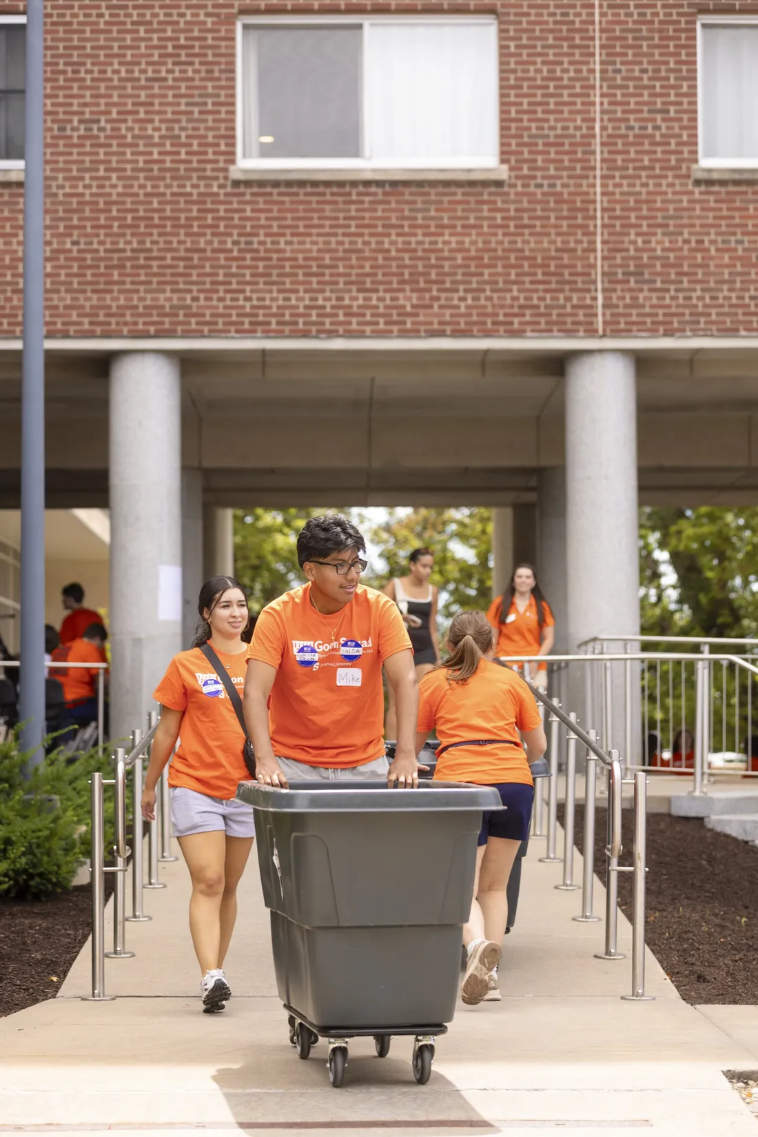 Goon Squad member pushing a cart.