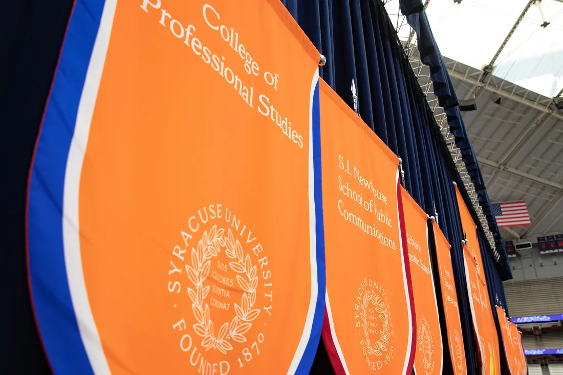 College of Professional Studies banner at the Syracuse University commencement.