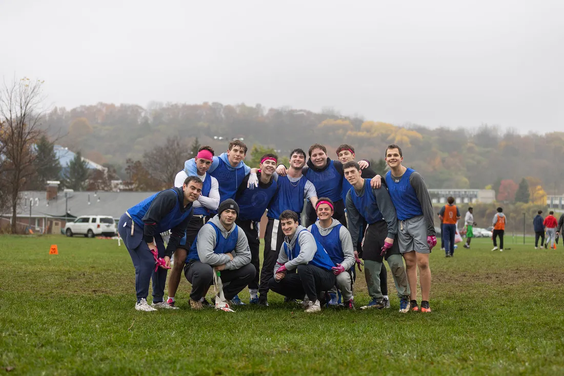 Flag football team posing and smiling.