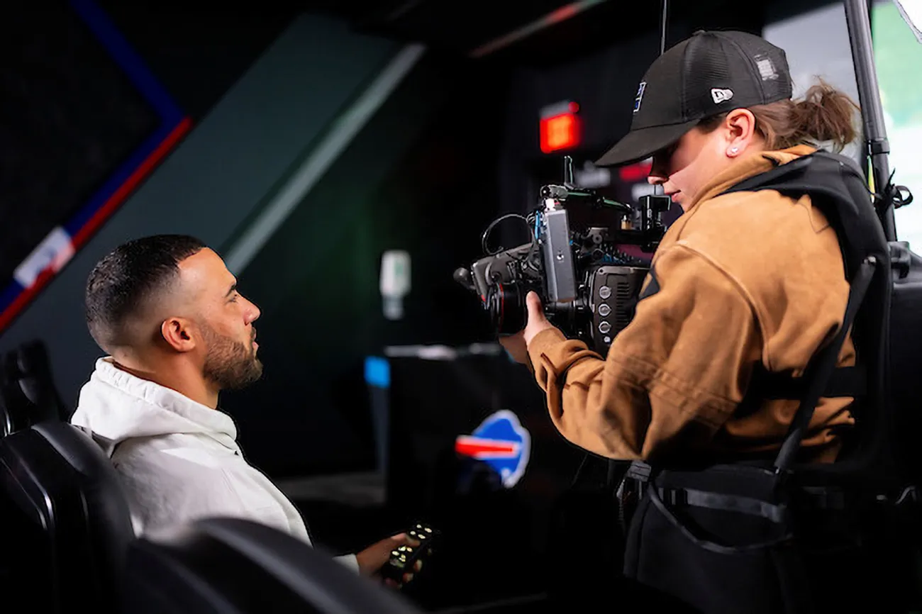 Nina Lindberg G'22 filming a member of the Buffalo Bills football team.