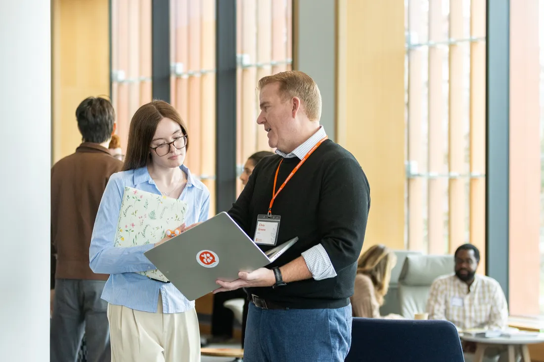 Two people speaking at a career conference.