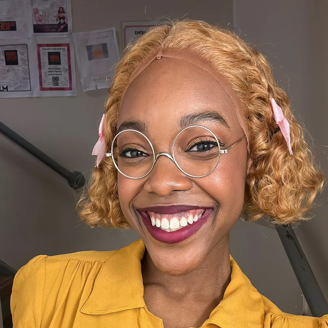 Broadway actress taking a selfie in a yellow polo shirt