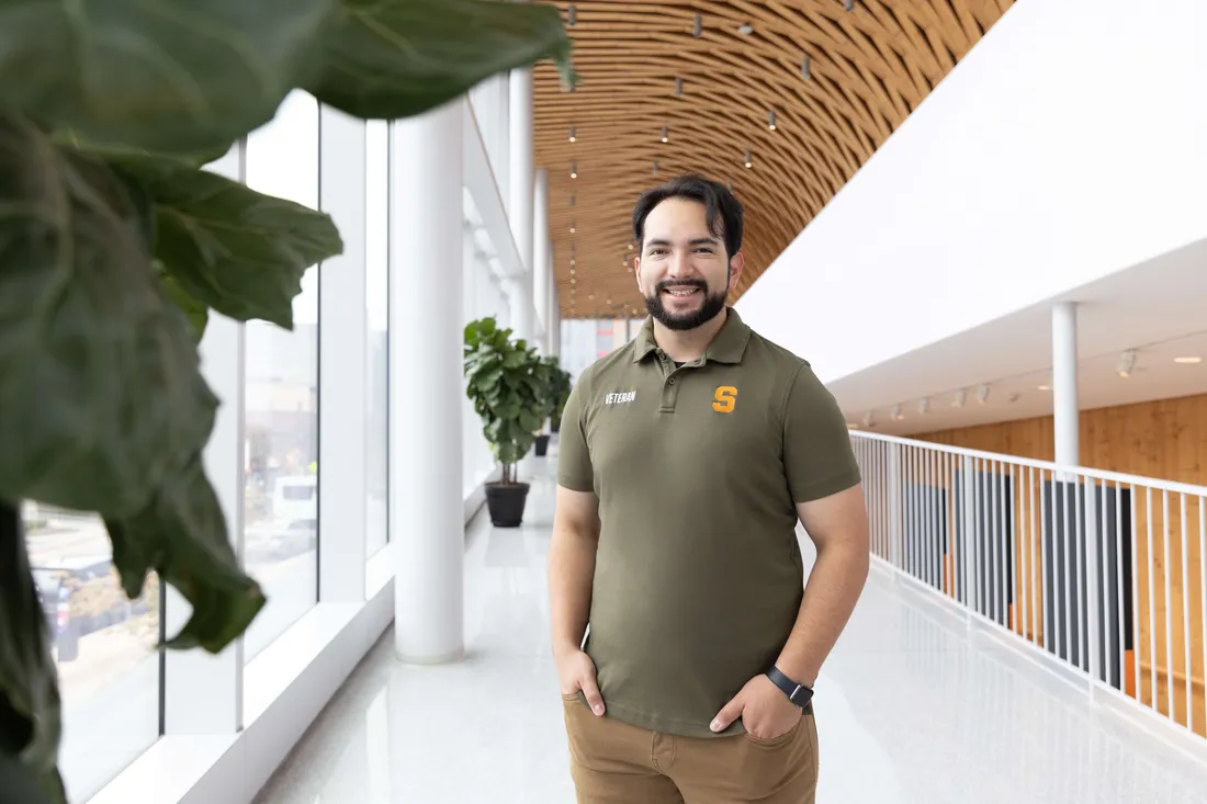 Veteran ambassador José Baeza Ruiz standing and smiling.