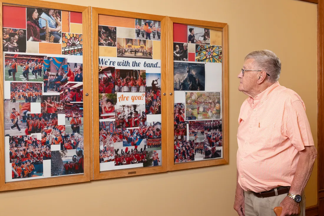 A person staring a collage of photos.