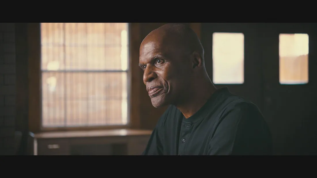 Robert Parrish in a scene of an interview.
