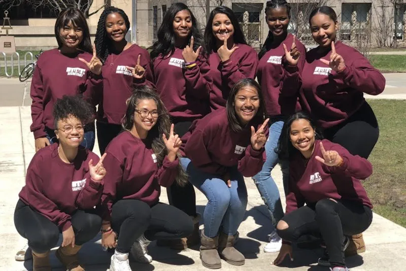 Outdoor group photo of Shaylah Nichols and J.U.M.P. Nation mentors.