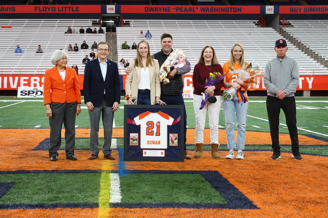 Katie Rowan Thomson ’09 at stadium with family.