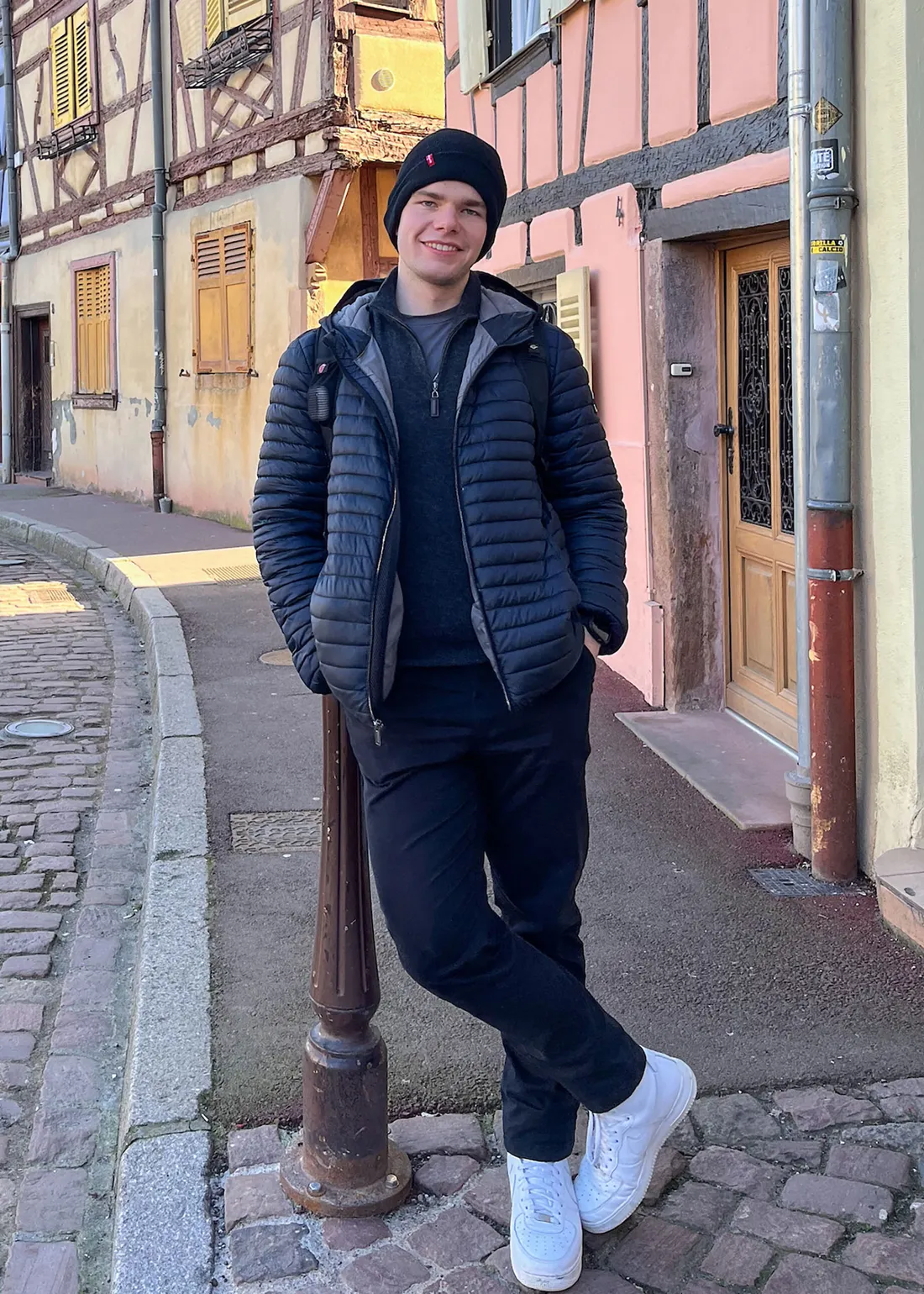 Person walking down a street in Strasboug.
