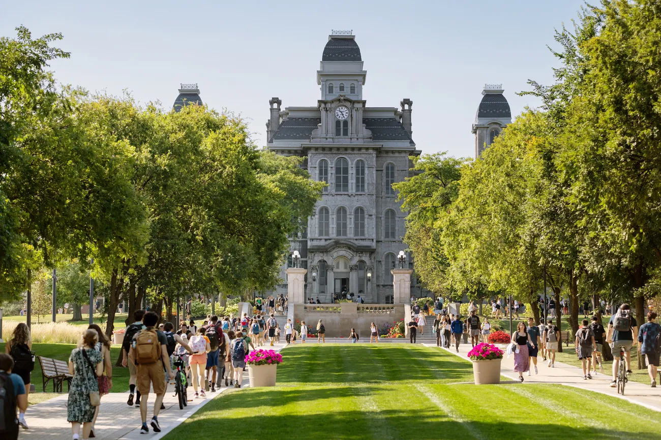 People walking on Syracuse's campus.