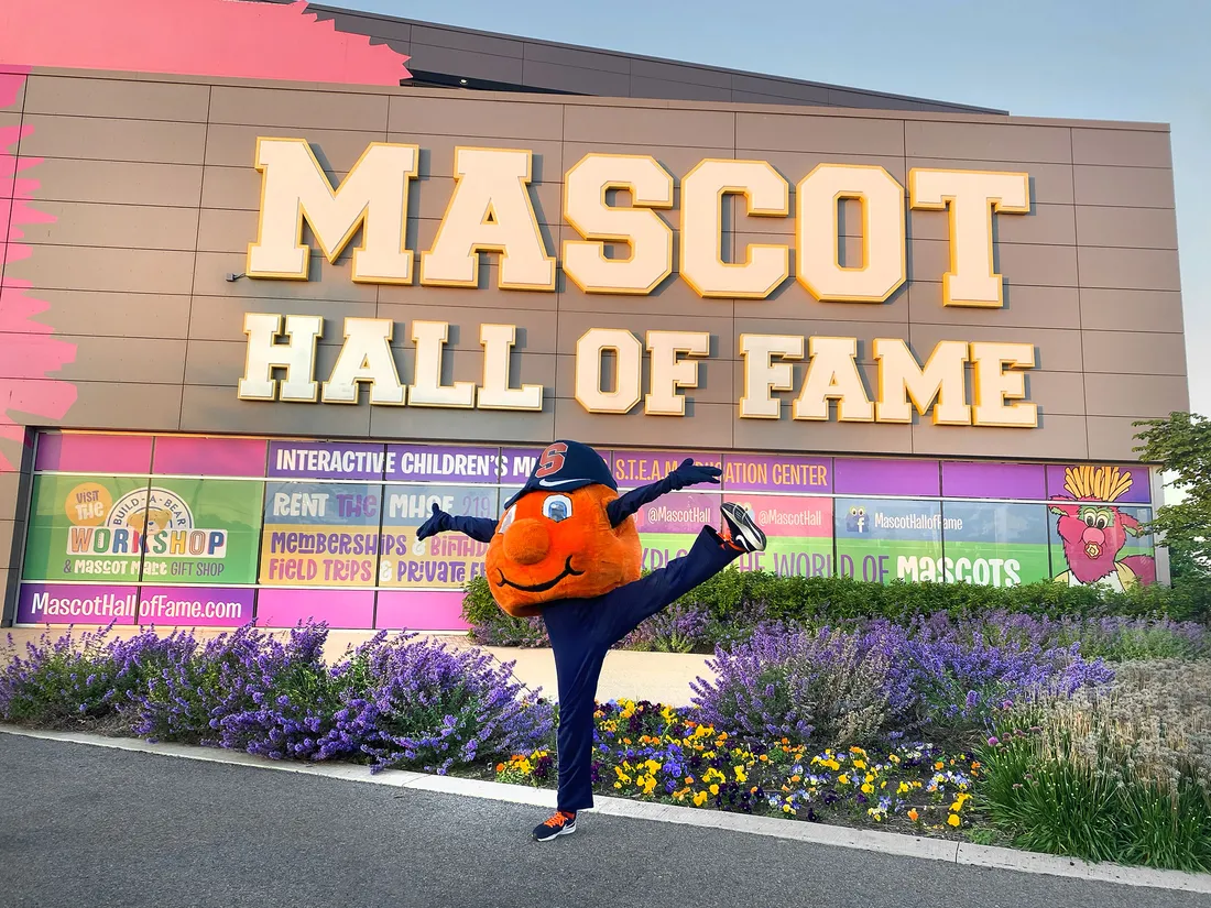 Otto the orange cheering outside the Mascot Hall of Fame.