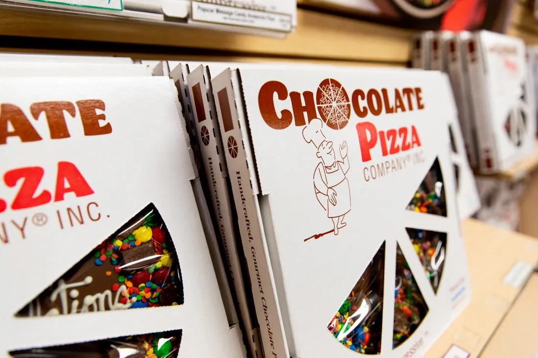 A shelf of chocolate pizzas.