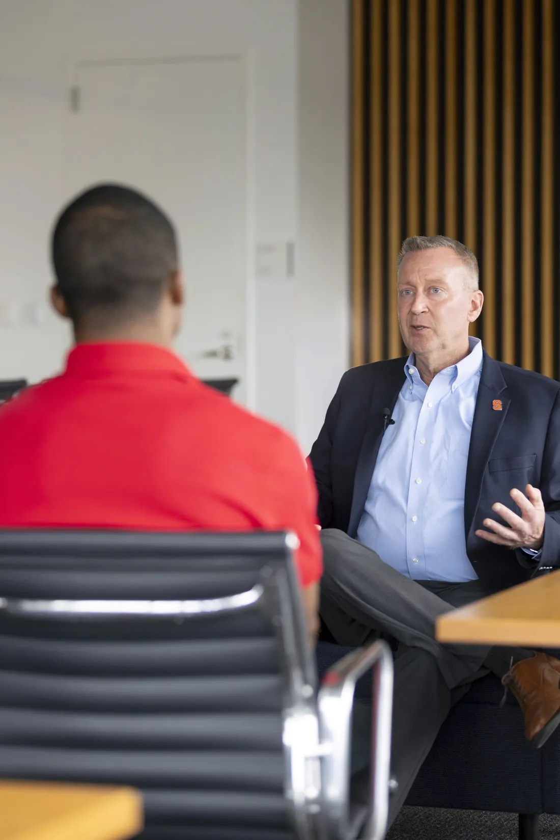 Chancellor Haynie sitting with a student and speaking for an interview.