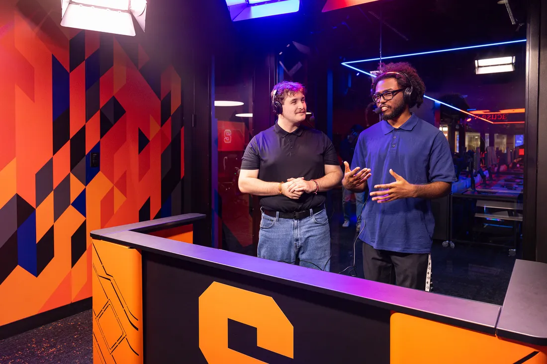 Two broadcasters speaking about esports.