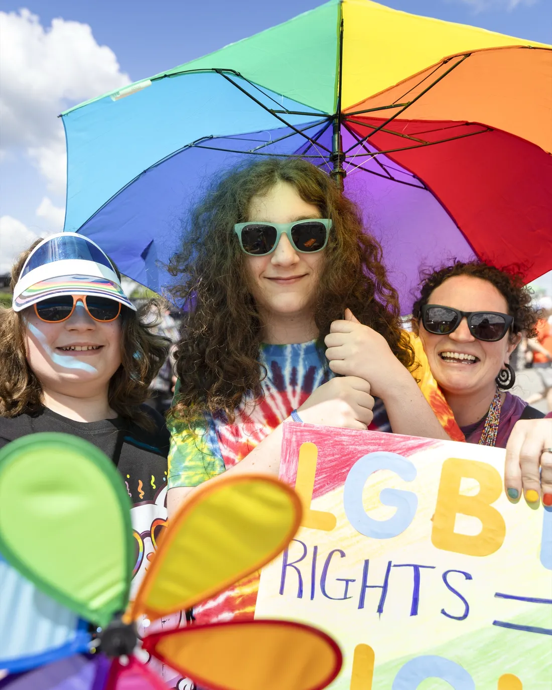 Syracuse Universtiry affiliated people celebrating at the CNY Pride Parade.