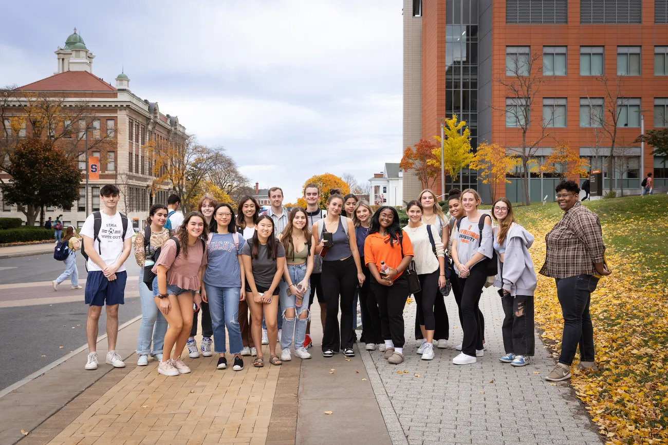 Students on a street in downtown Syracuse.