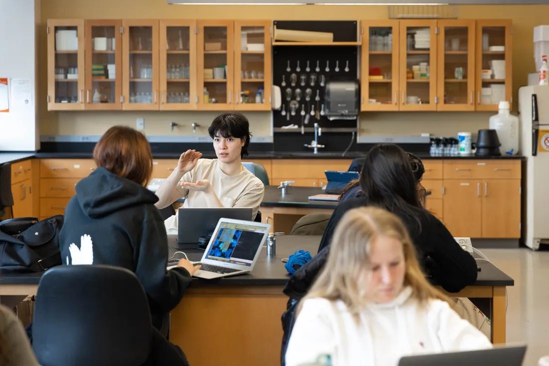 Students sit in biology classroom.