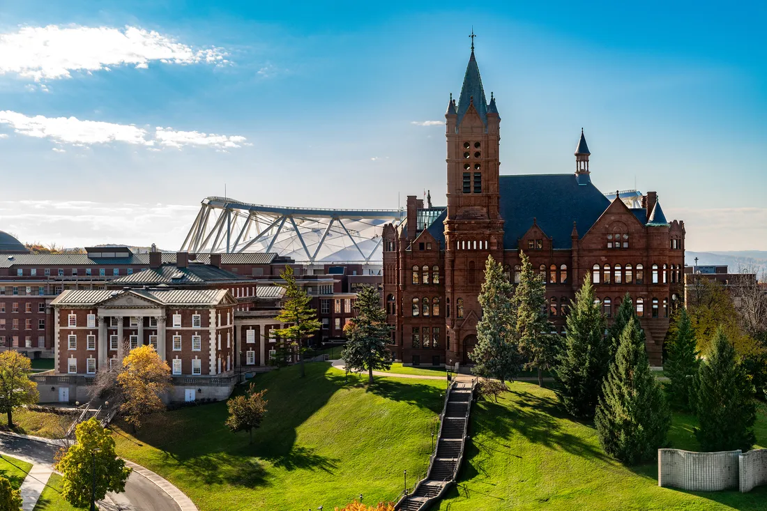 Aerial photograph of Syracuse University campus on a blue sky autumn day.