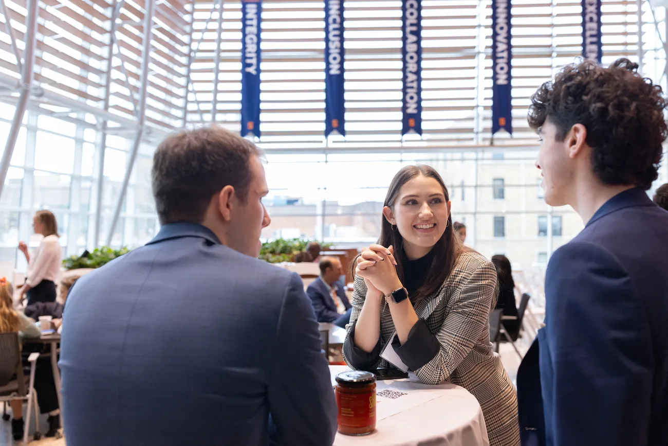 People taking to each other at a table.