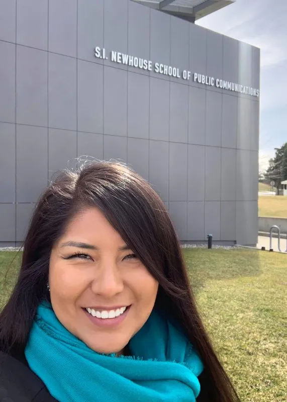 Jourdan Bennett-Begaye smiling outside of the Newhouse School.