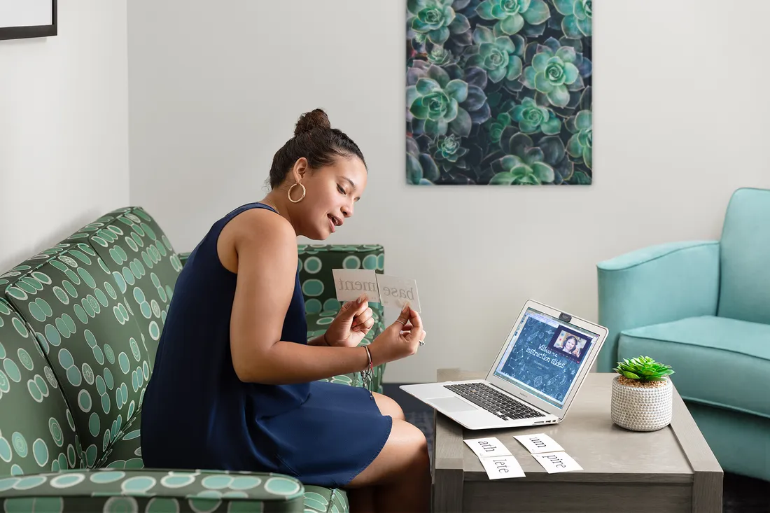 Woman on laptop zooms with a patient