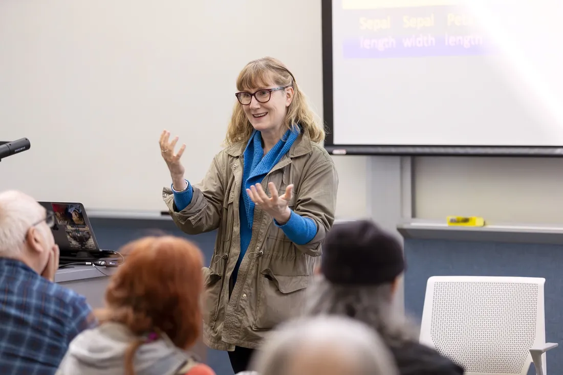 Professor talking to a room of students.