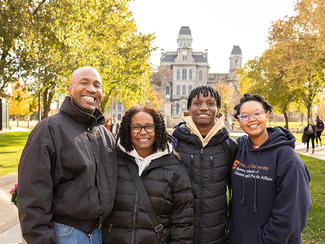 People standing together to pose for pictures.