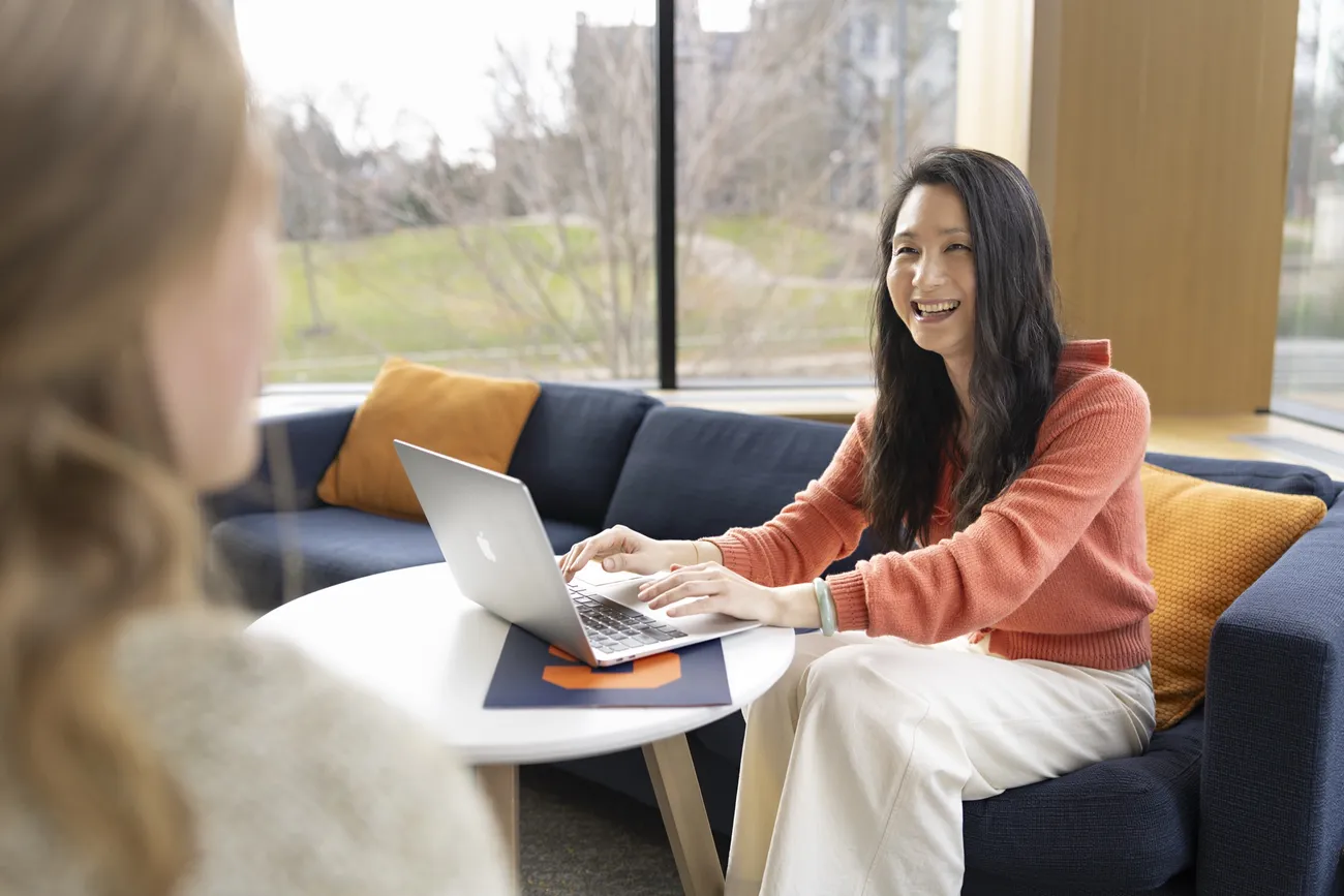 International student Hua Fan talking with a friend.