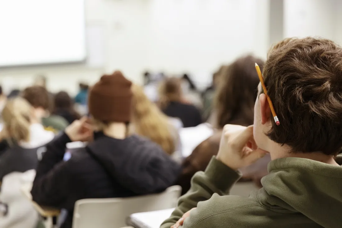 Students sitting in a classroom.