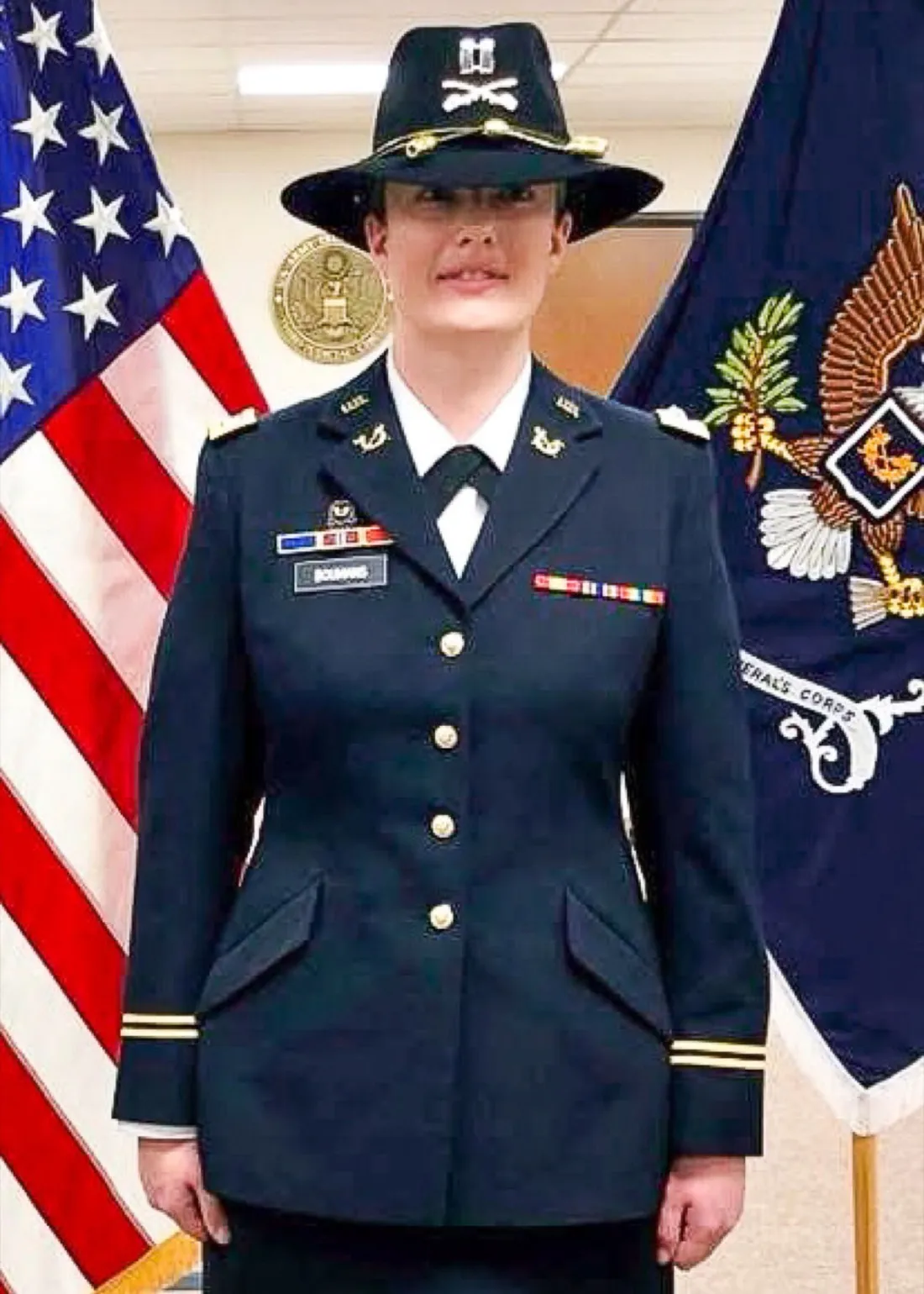 Katie Verderber posing in uniform during her service as a U.S. Army JAG Corps officer.
