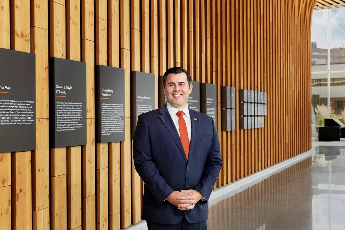 Portrait of student veteran standing inside NVRC building.