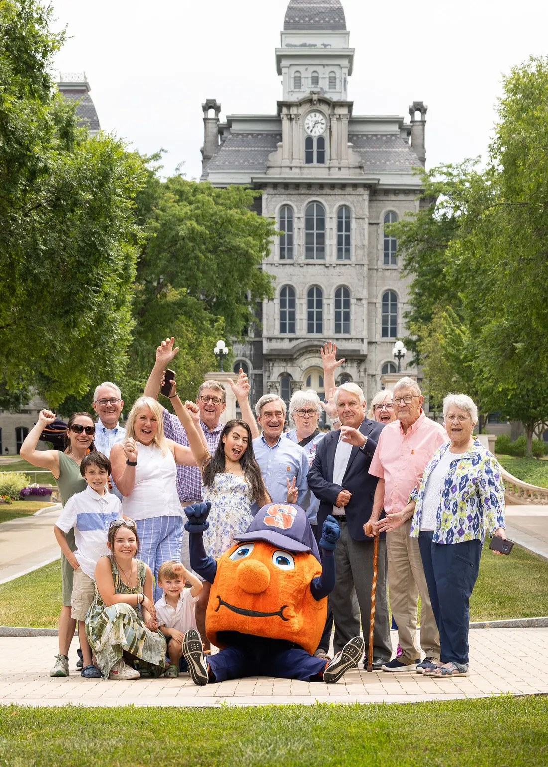 The entire family of the five generations story in front of the hall of languages.